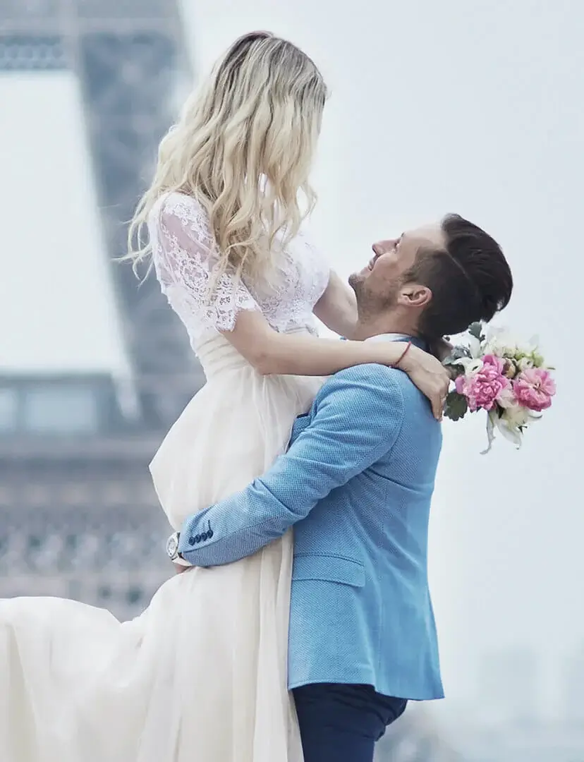 Just married couple in Paris, France. Beautiful young bride and groom near the Eiffel tower. Romantic wedding in Paris concept